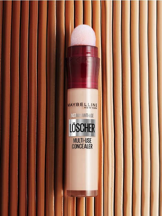 Maybelline Instant Anti-Age Löscher Concealer auf beigem Hintergrund.